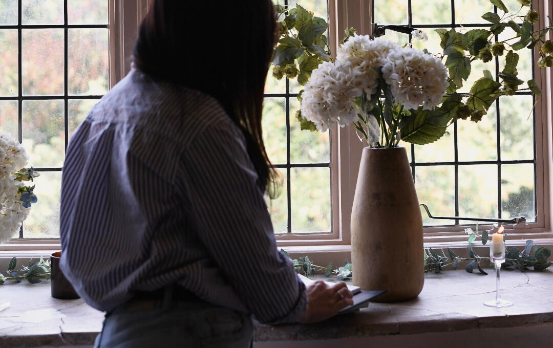 Arranging a silver candelabra by hand at Coughton Court, where The Story Room is based.